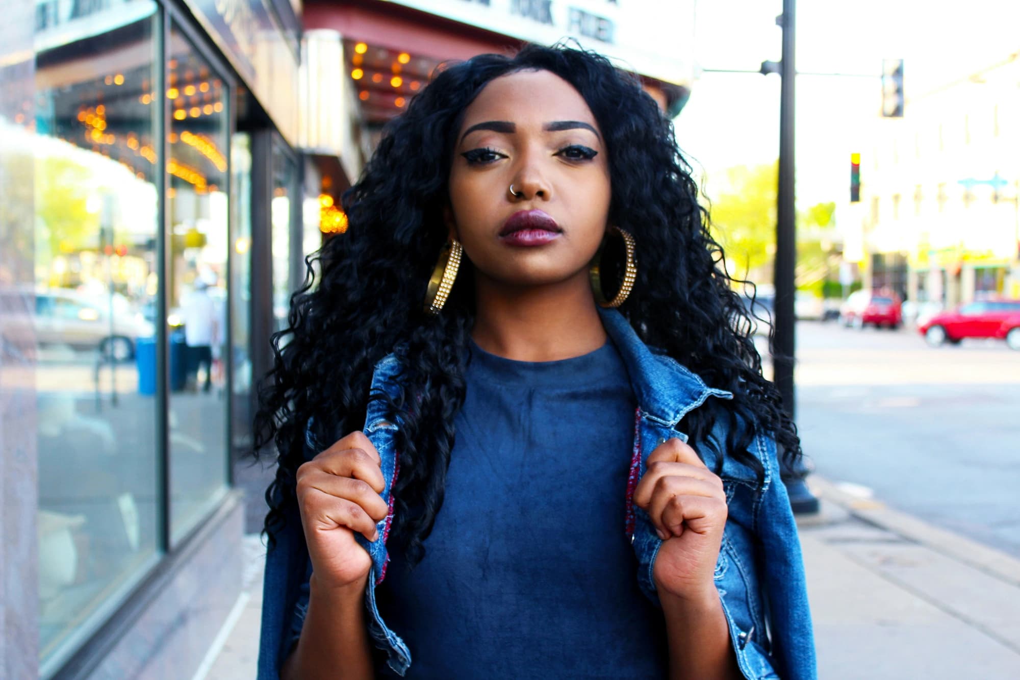 Woman looking straight into the camera with attitude